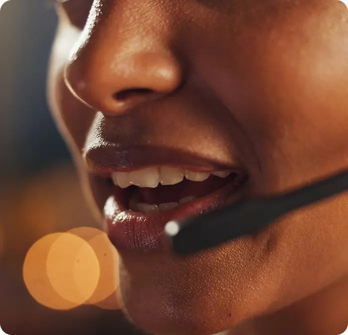 Image of woman speaking into headphone
